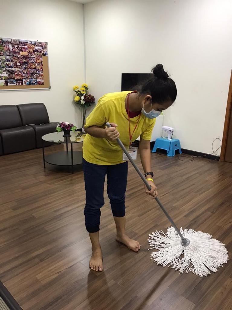 Mopping a floor during a cleaning session